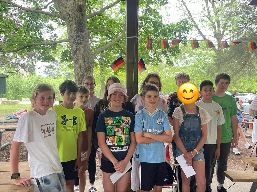 Families gathered outdoors for the school picnic