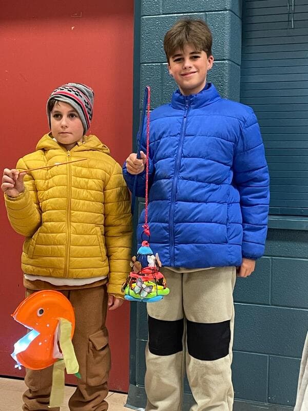 Student holding a handmade lantern