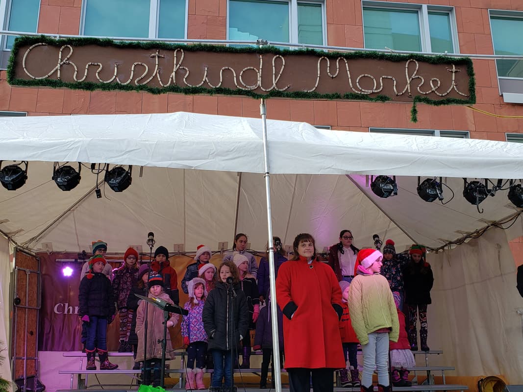 Children's choir performing at the Kitchener Christkindlmarket